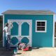 Couple painting their shed